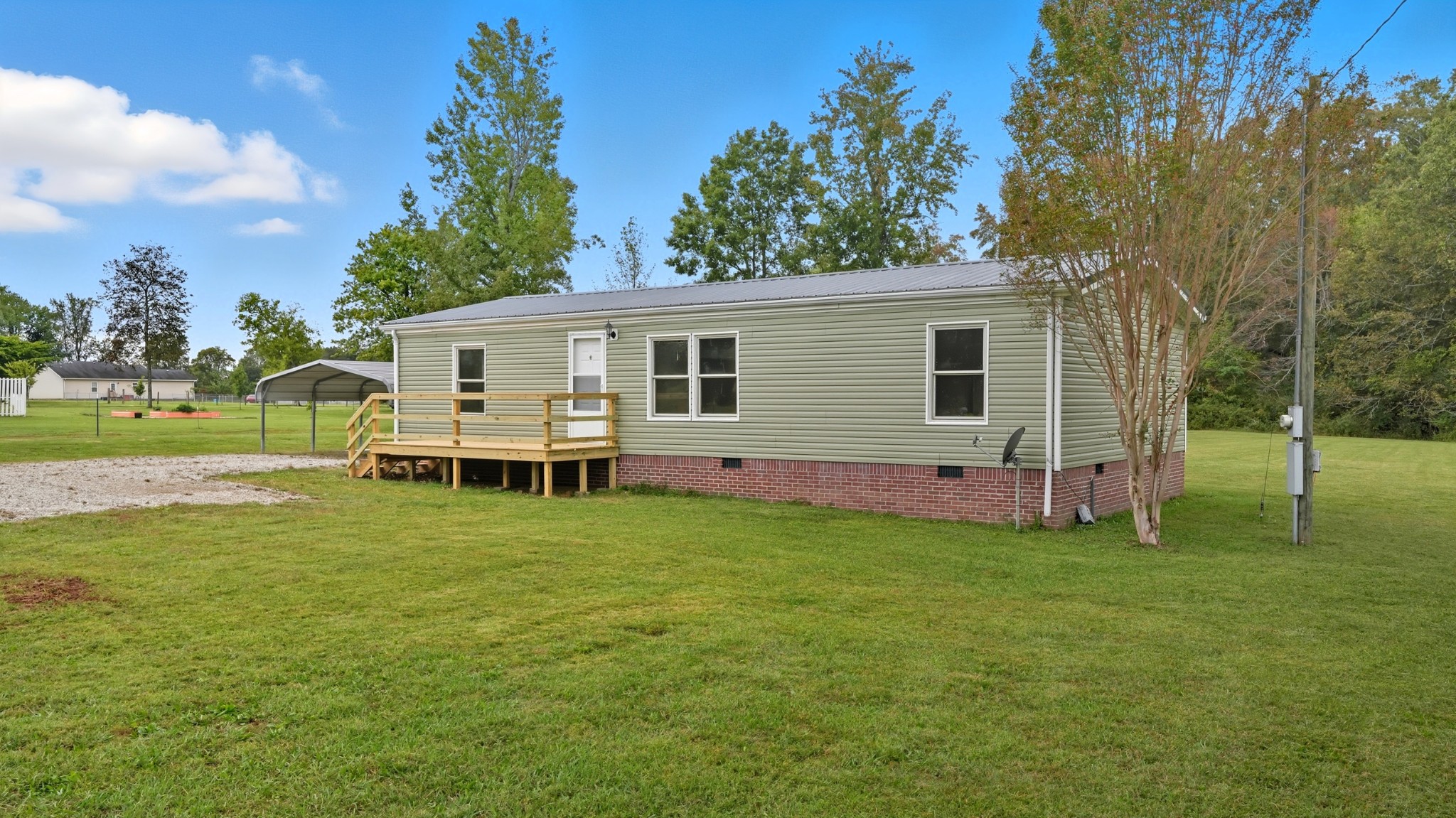 5425 Awalt Road Tullahoma, TN 37388 - Photo 3 of 33 a backyard of a house with table and chairs