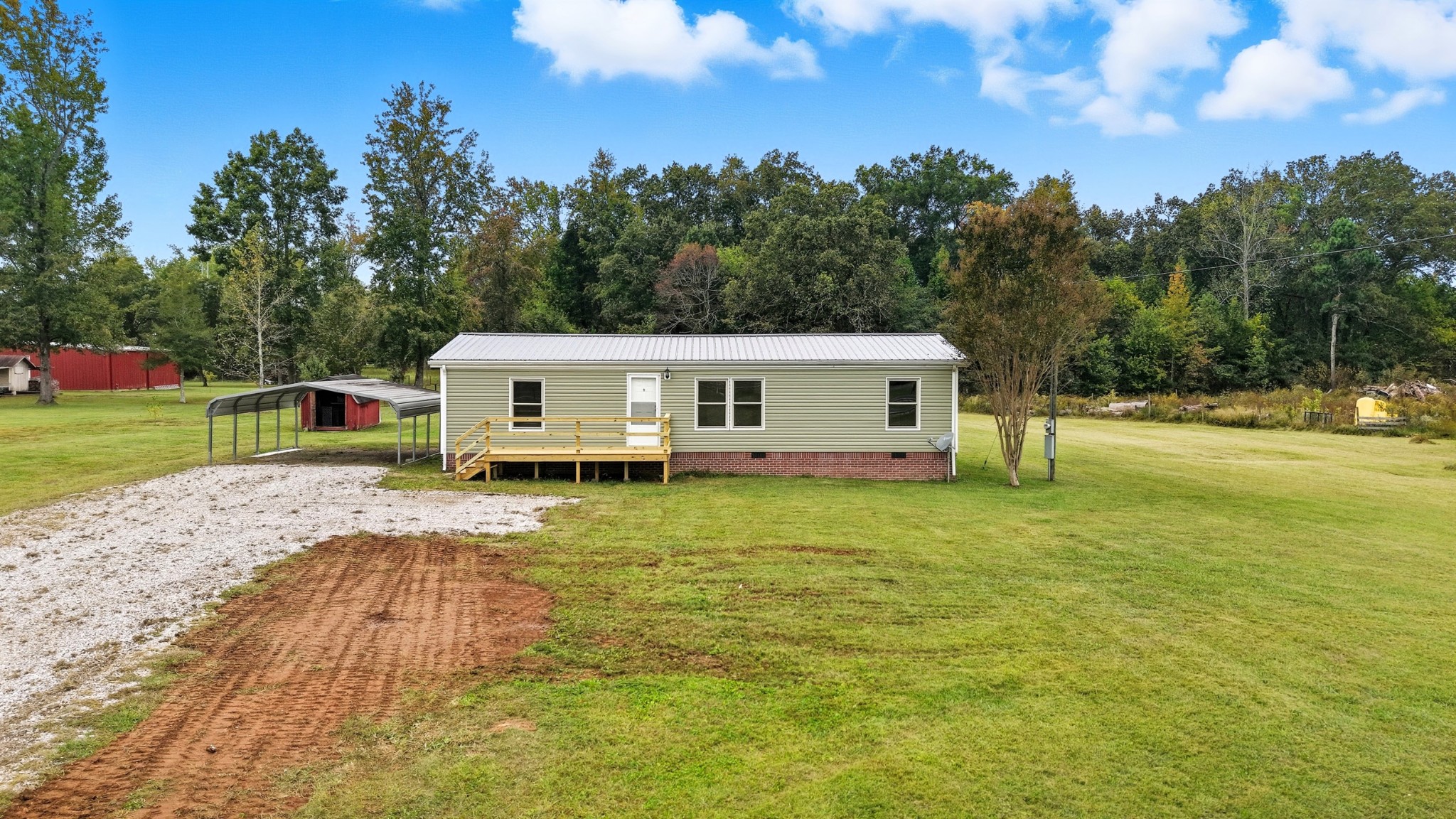 5425 Awalt Road Tullahoma, TN 37388 - Photo 33 of 33 a view of a house with backyard and trees