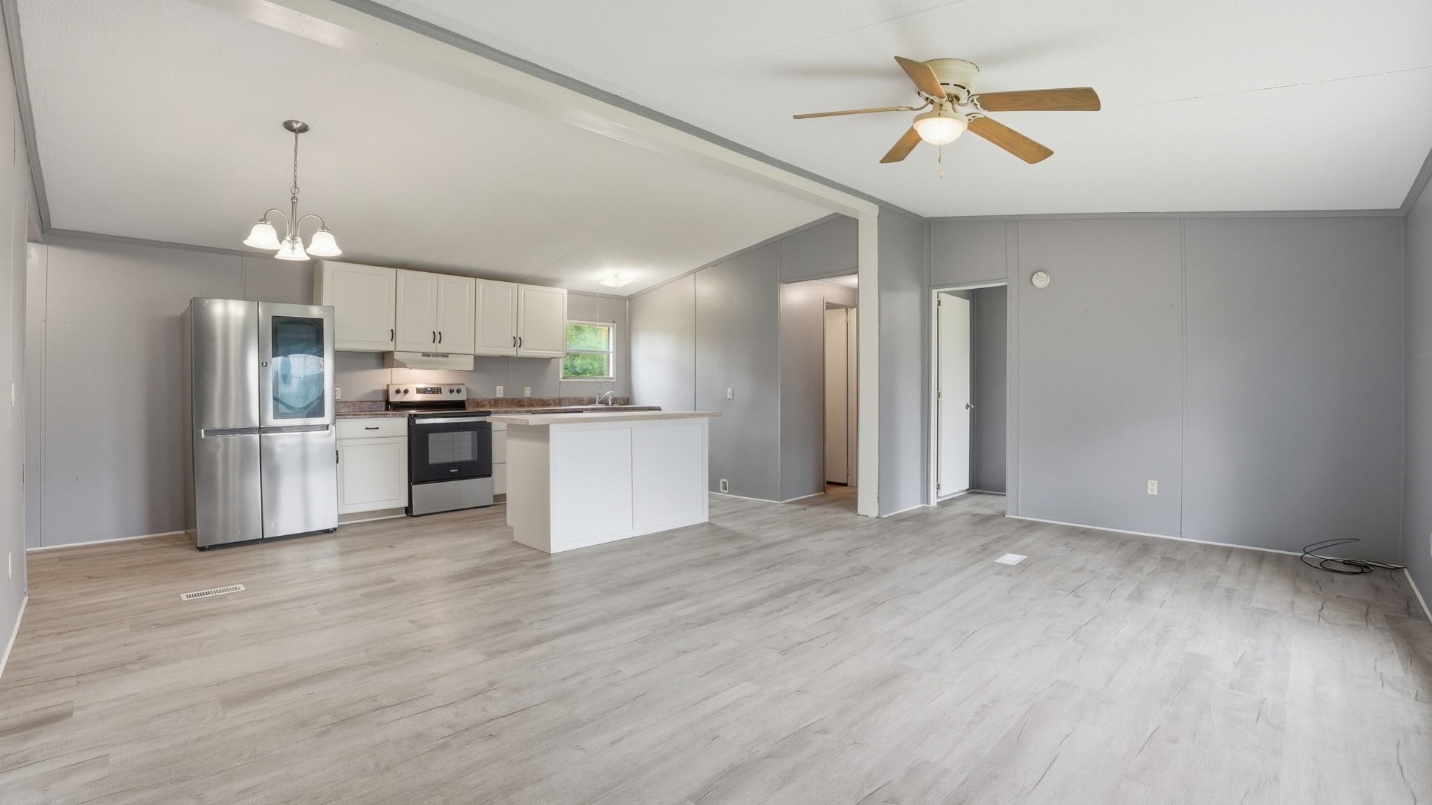 5425 Awalt Road Tullahoma, TN 37388 - Photo 4 of 33 a view of kitchen with refrigerator microwave and stove