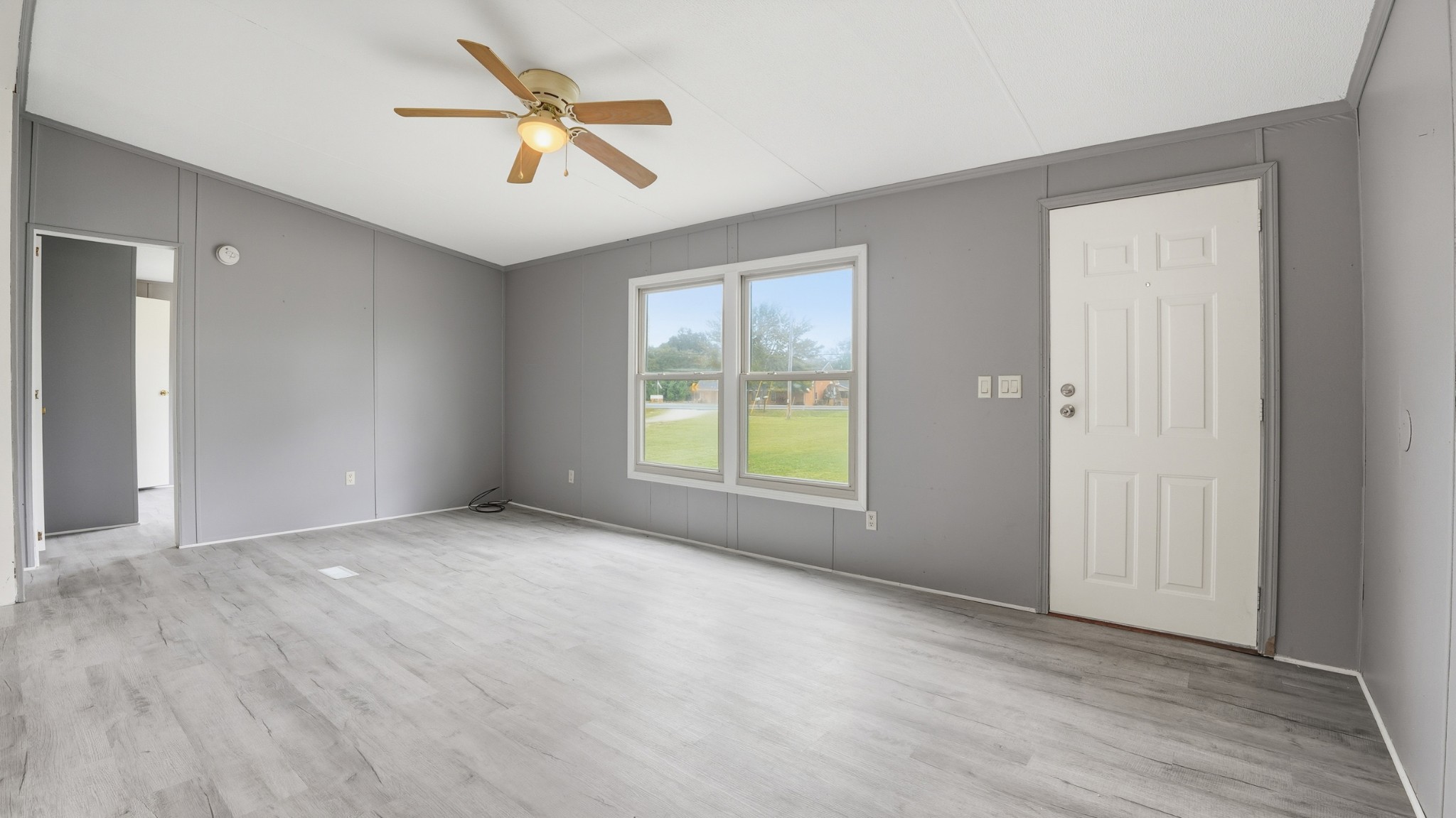 5425 Awalt Road Tullahoma, TN 37388 - Photo 6 of 33 wooden floor in an empty room with a window