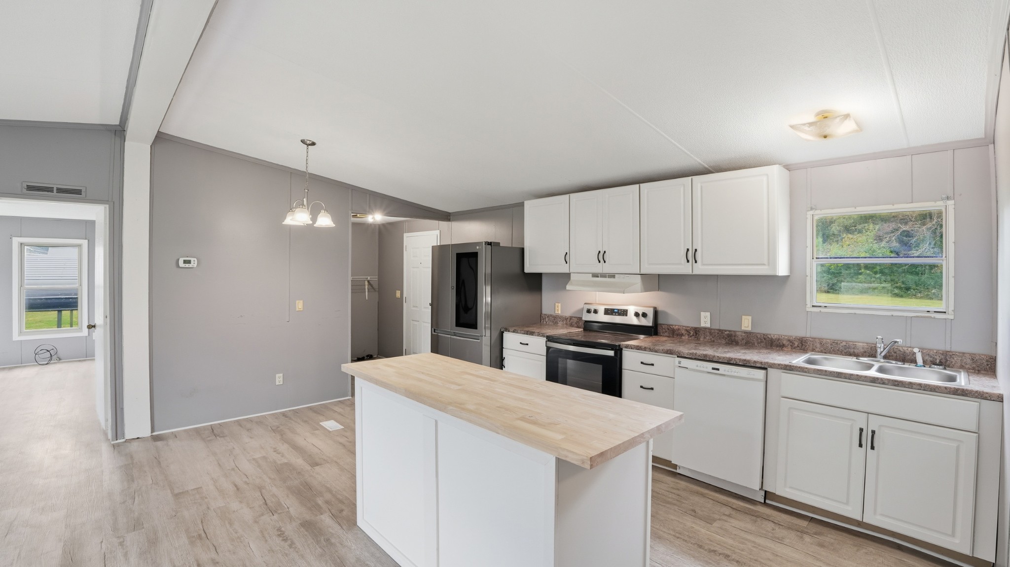 5425 Awalt Road Tullahoma, TN 37388 - Photo 8 of 33 a kitchen with white cabinets appliances and sink