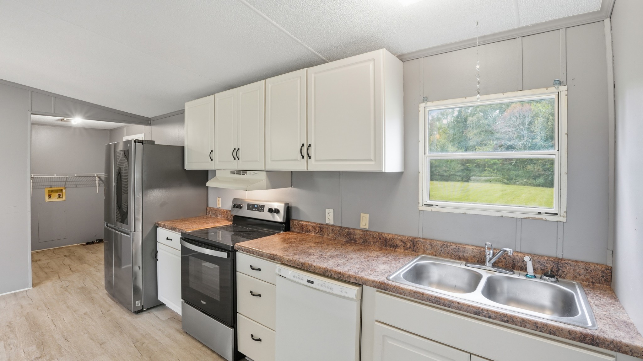 5425 Awalt Road Tullahoma, TN 37388 - Photo 9 of 33 a kitchen with stainless steel appliances granite countertop a refrigerator sink and cabinets