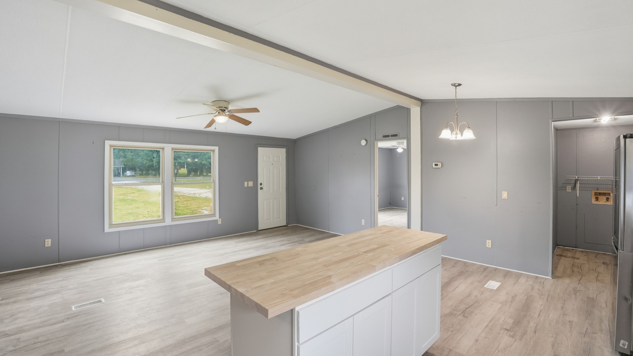 5425 Awalt Road Tullahoma, TN 37388 - Photo 10 of 33 a view of an empty room with wooden floor and a window
