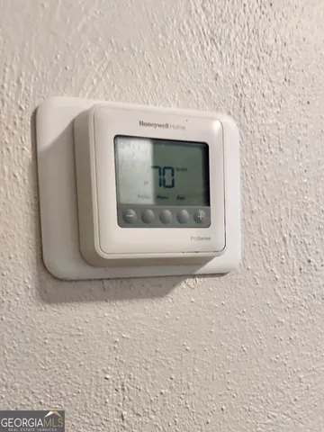 a utility room with a mirror