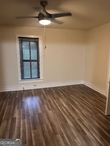 a view of a kitchen from a hallway