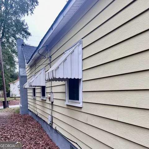 a small white house with a outdoor space