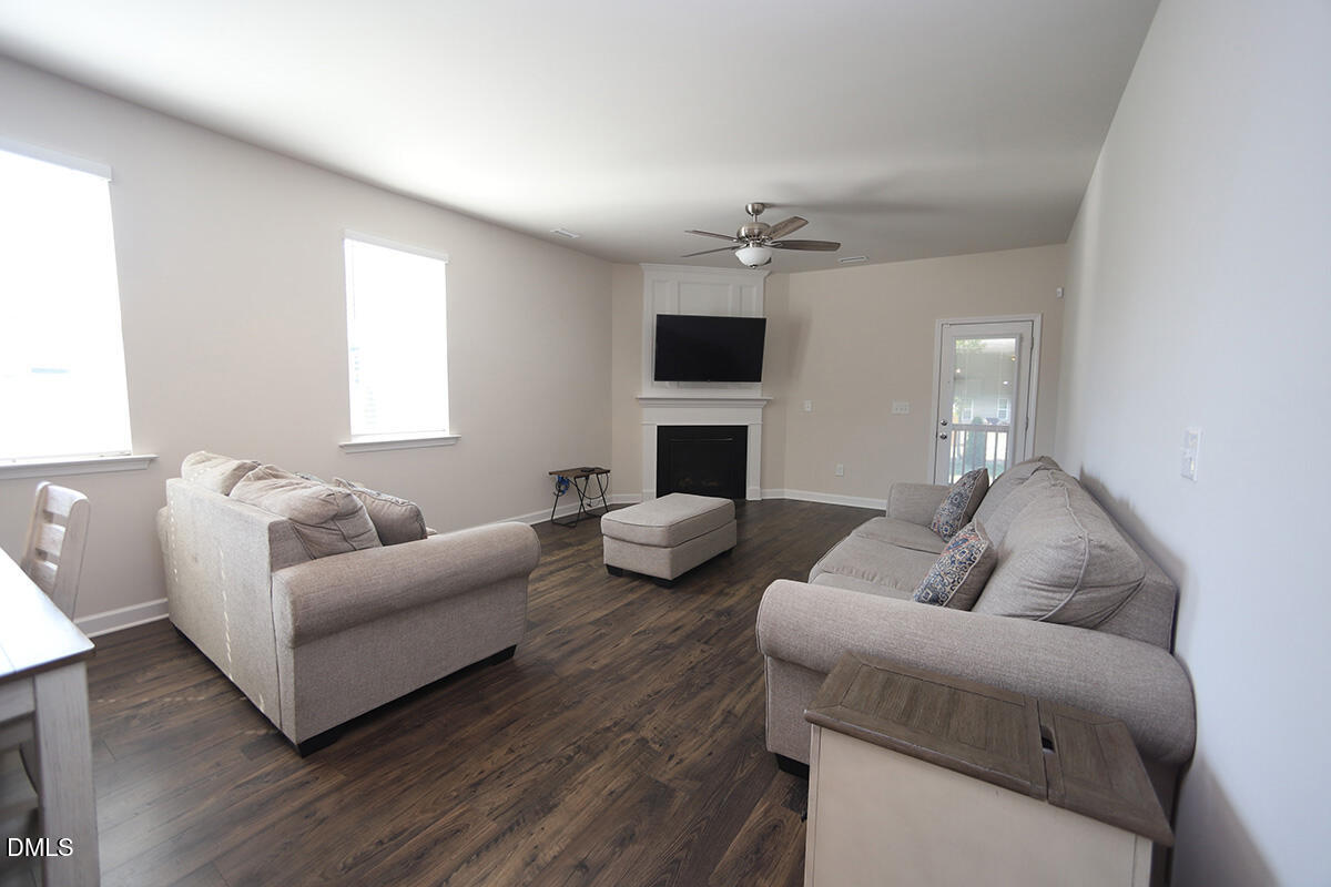125 Mae Court Roxboro, NC 27573 - Photo 15 of 30 a living room with furniture fireplace and a flat screen tv