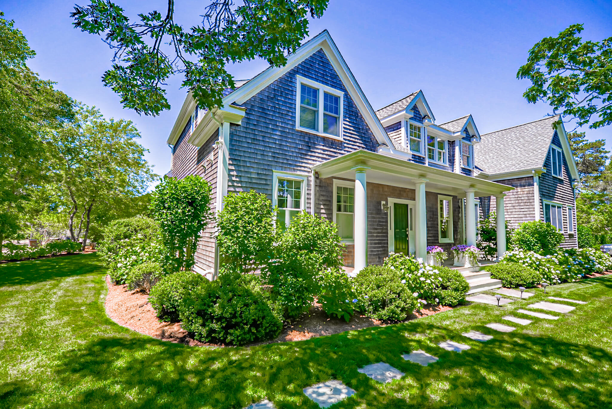 53 Rd To The Plaines Edgartown, MA 02539 - Photo 1 of 35 a front view of a house with a yard