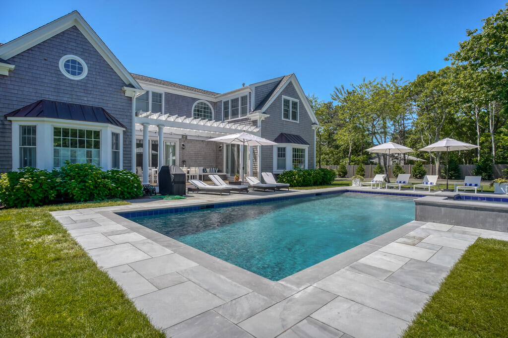 53 Rd To The Plaines Edgartown, MA 02539 - Photo 2 of 35 a front view of a house with swimming pool having outdoor seating