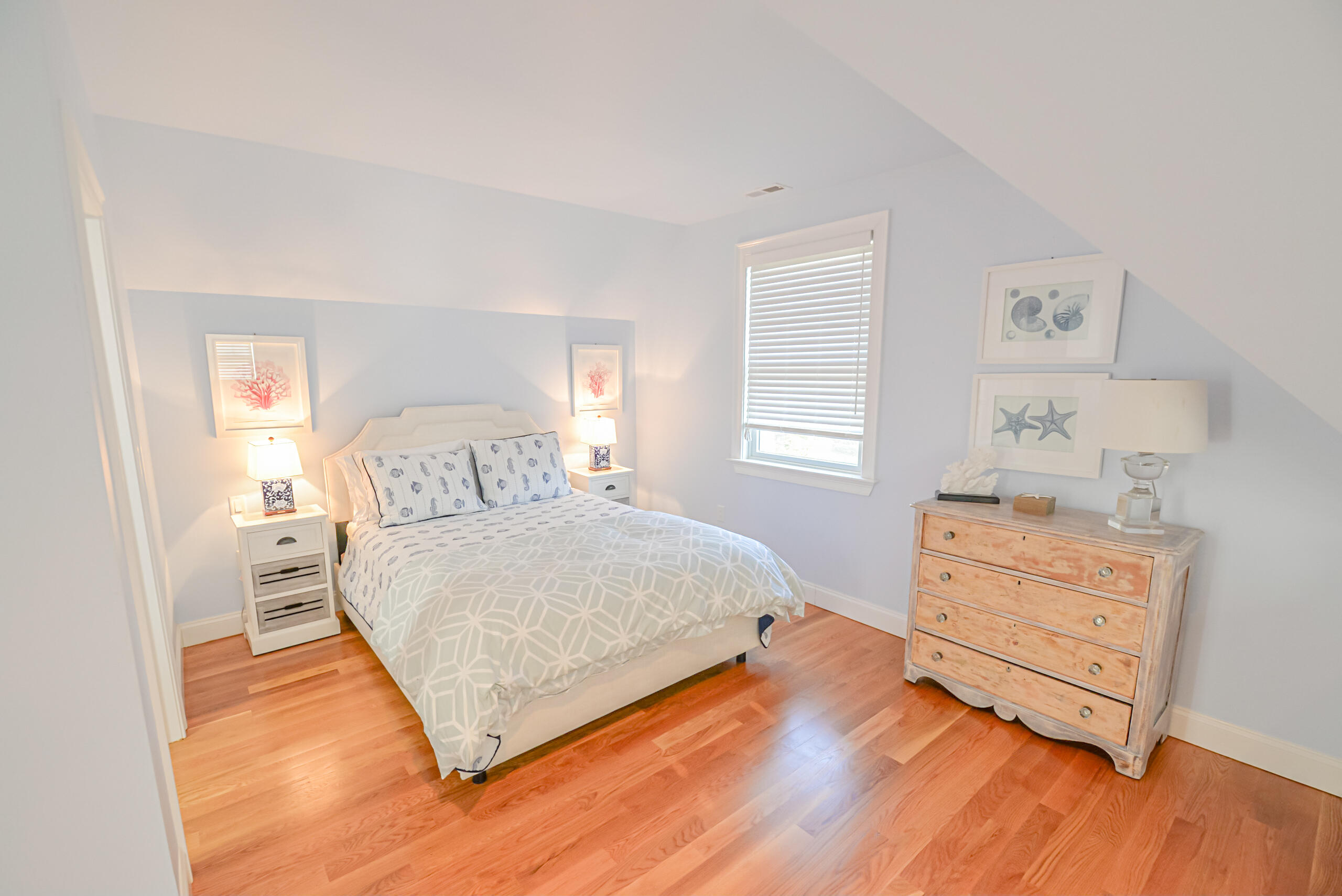 53 Rd To The Plaines Edgartown, MA 02539 - Photo 21 of 35 a bedroom with a bed and wooden floor