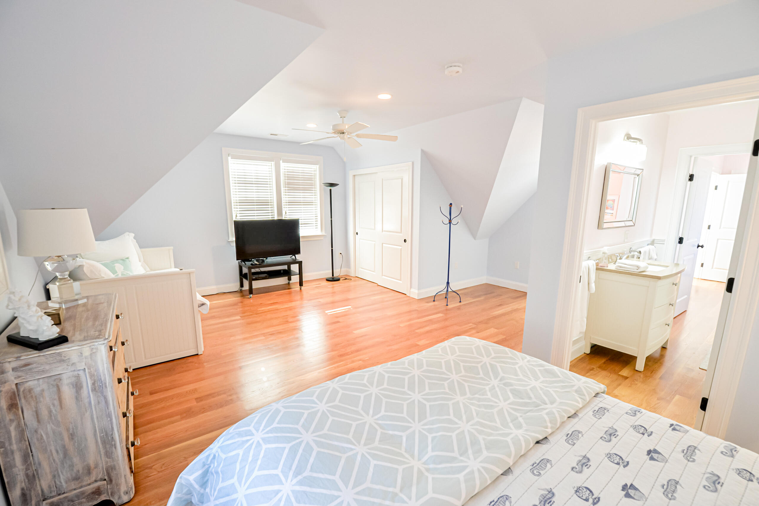 53 Rd To The Plaines Edgartown, MA 02539 - Photo 22 of 35 a bedroom with a bed and wooden floor