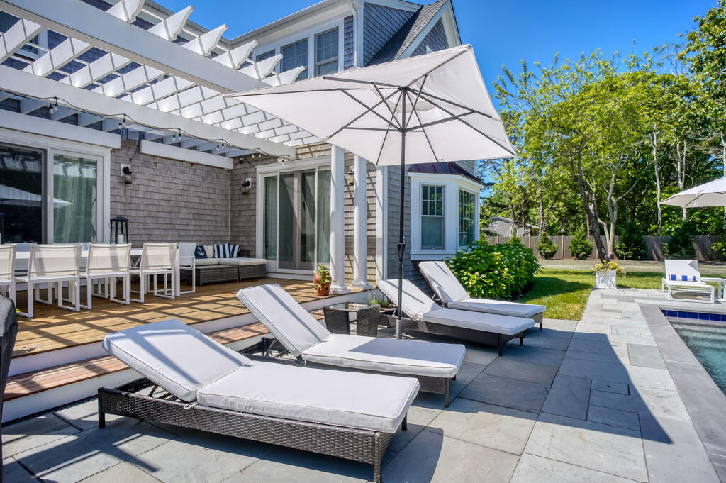 53 Rd To The Plaines Edgartown, MA 02539 - Photo 30 of 35 a view of a patio with swimming pool table and chairs