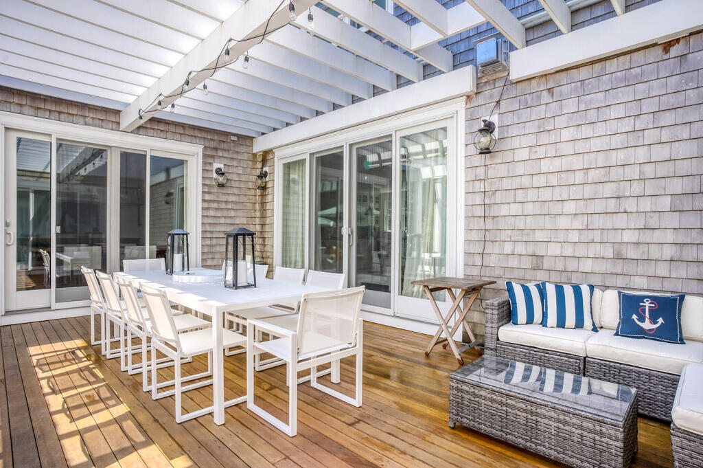 53 Rd To The Plaines Edgartown, MA 02539 - Photo 32 of 35 a view of a dining room with furniture wooden floor and windows