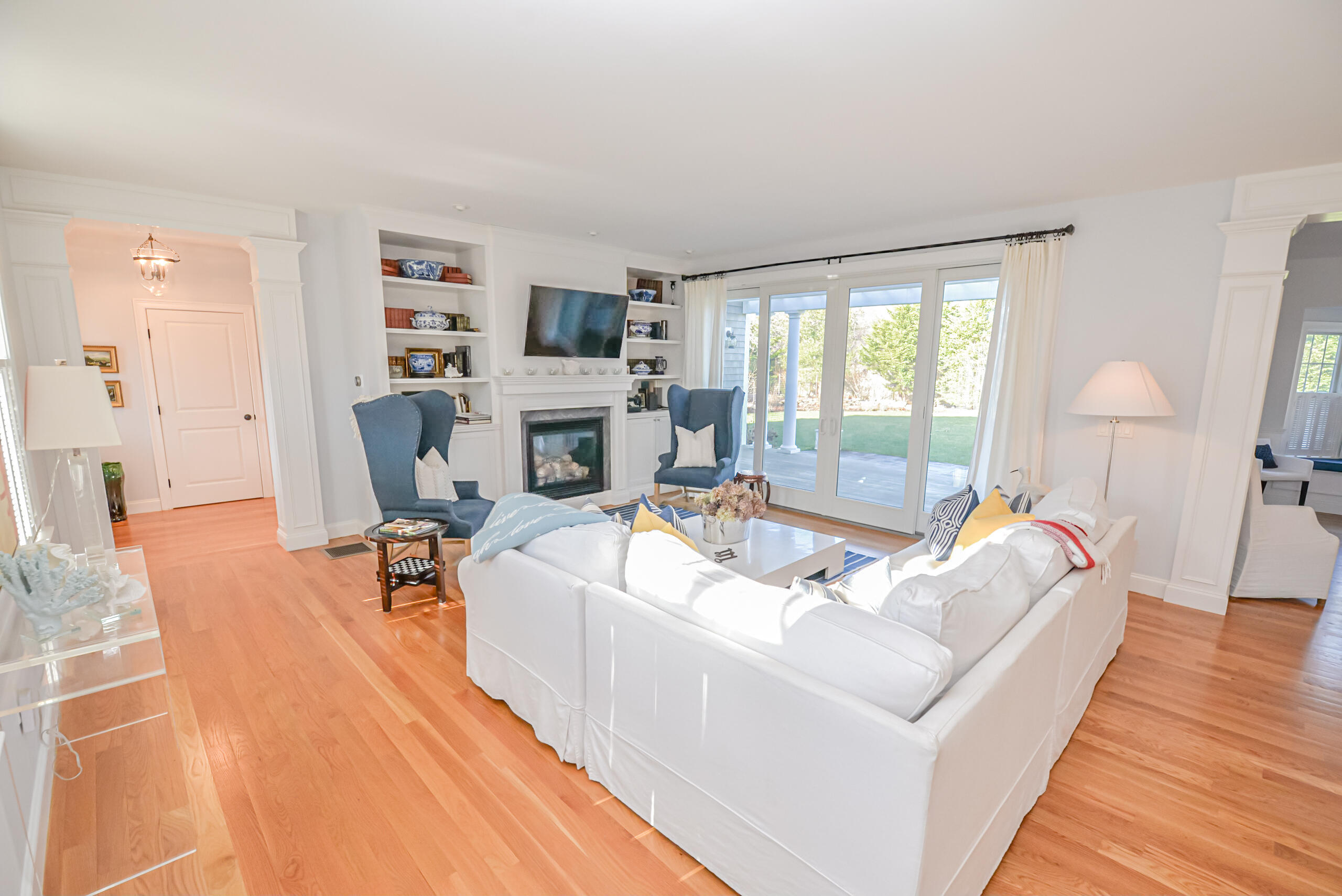 53 Rd To The Plaines Edgartown, MA 02539 - Photo 4 of 35 a living room with furniture a fireplace and a flat screen tv