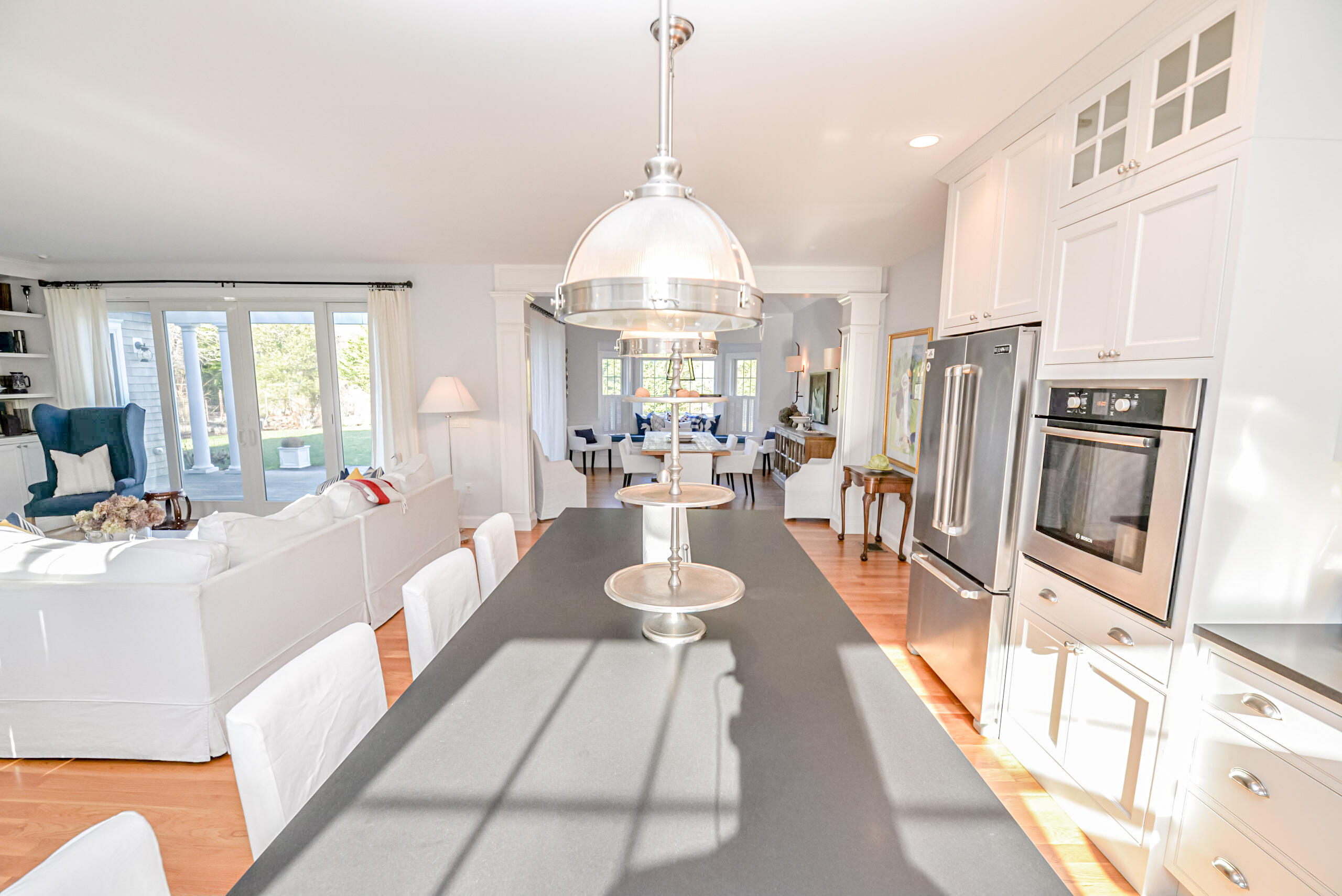 53 Rd To The Plaines Edgartown, MA 02539 - Photo 5 of 35 a very nice looking open dining room with a large window and chandelier