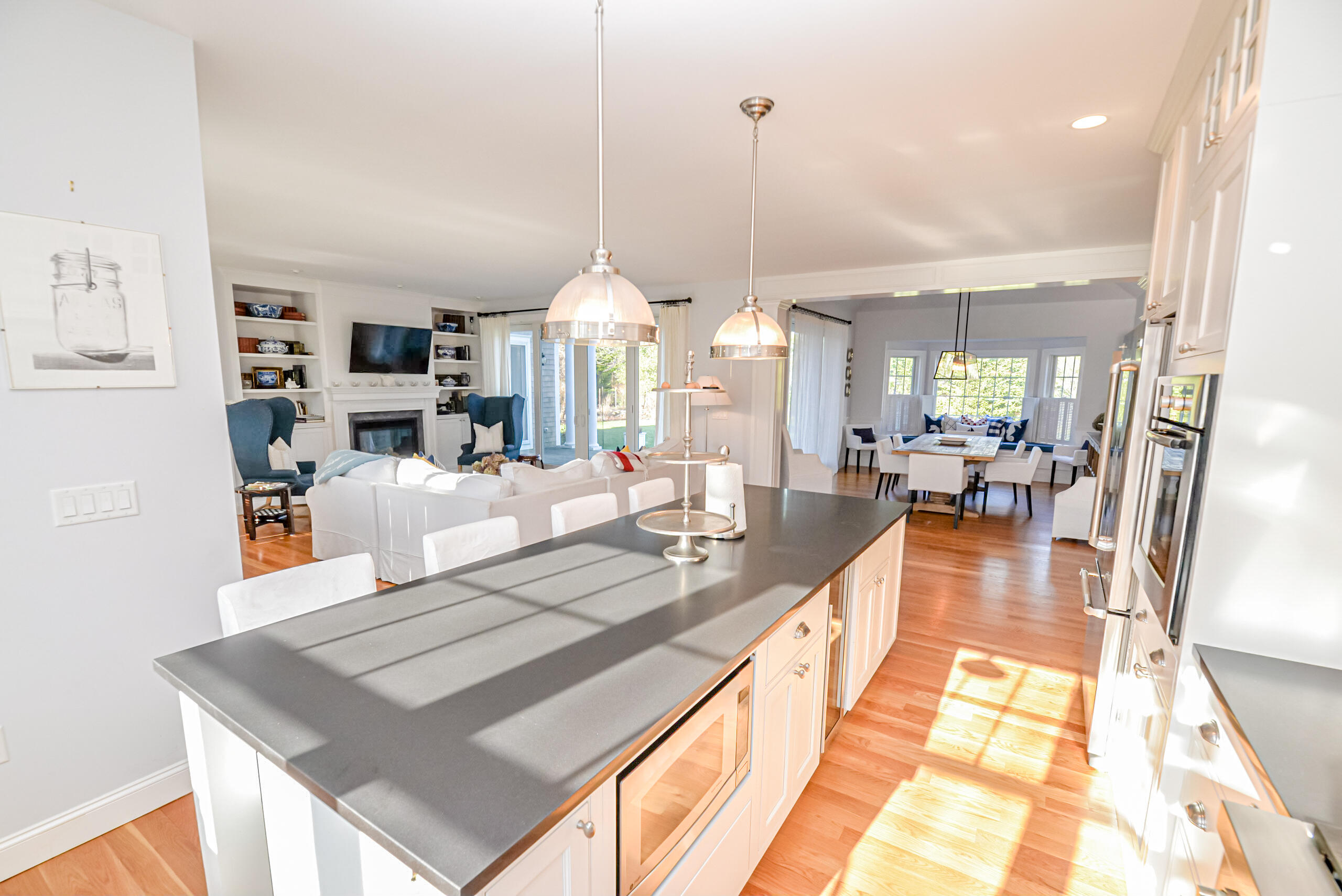 53 Rd To The Plaines Edgartown, MA 02539 - Photo 6 of 35 a dining hall with stainless steel appliances kitchen island granite countertop a table chairs and a view of living room