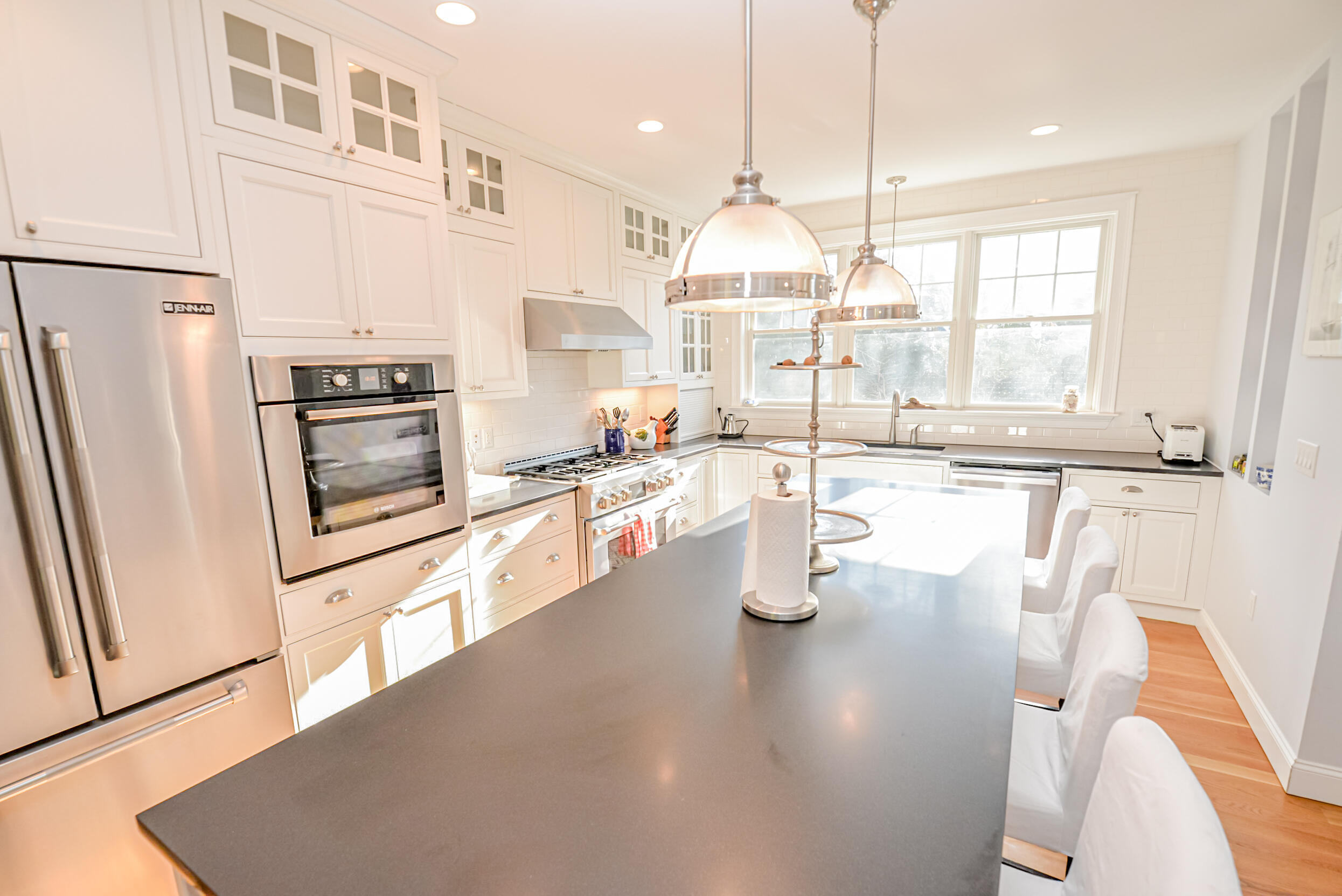 53 Rd To The Plaines Edgartown, MA 02539 - Photo 8 of 35 a kitchen with stainless steel appliances granite countertop a sink a stove and a refrigerator