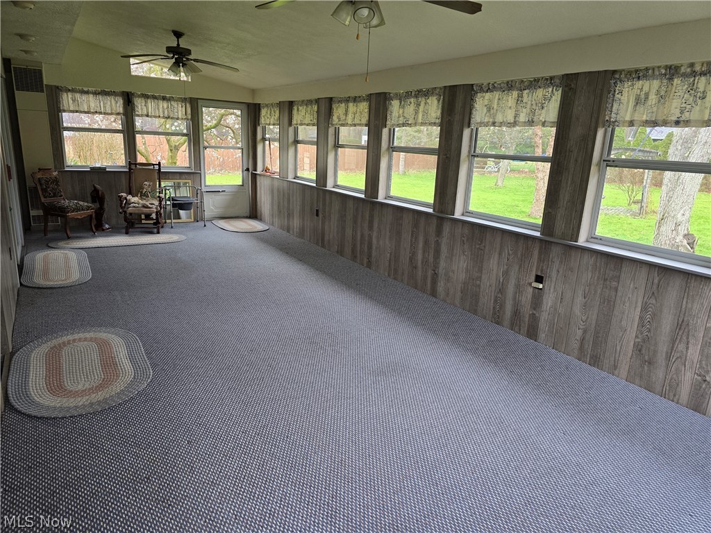 2550 Merria Road Stow, OH 44224 - Photo 7 of 22 Unfurnished sunroom with ceiling fan, vaulted ceiling, and plenty of natural light