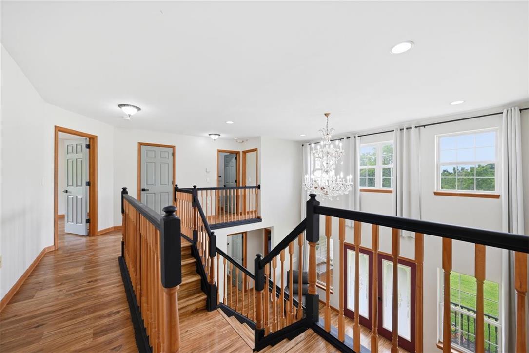 387 Blue Ridge Road Saylorsburg, PA 18353 - Photo 39 of 90 A grand, multi-level entryway features gleaming hardwood floors and an elegant chandelier.