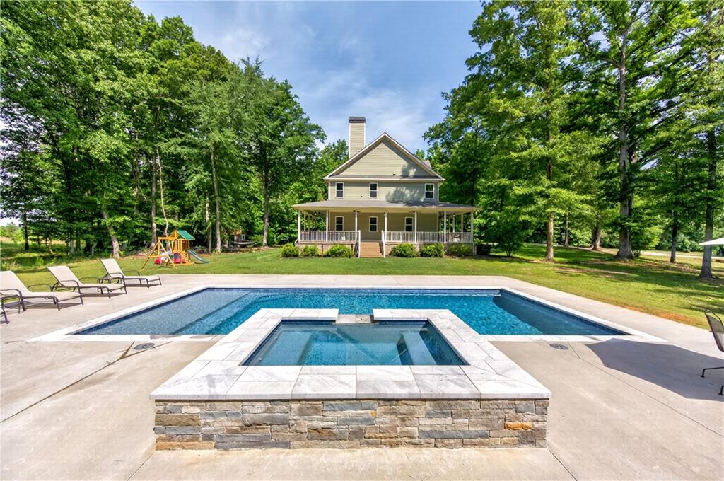 632 Geiger Road Jefferson, GA 30549 - Photo 2 of 55 a view of swimming pool with chairs