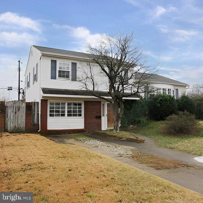 Charming two-story home with inviting curb appeal.