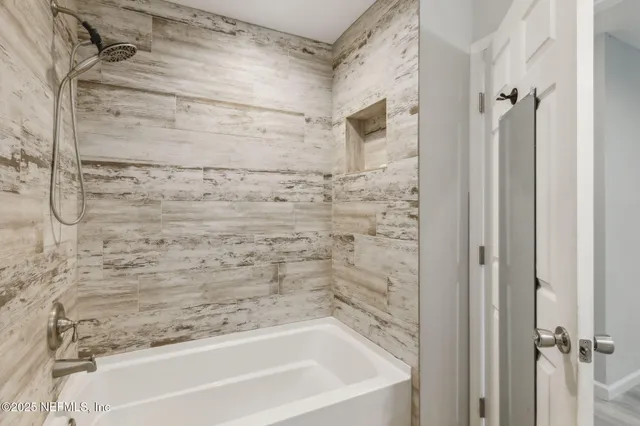 a bathroom with a bathtub