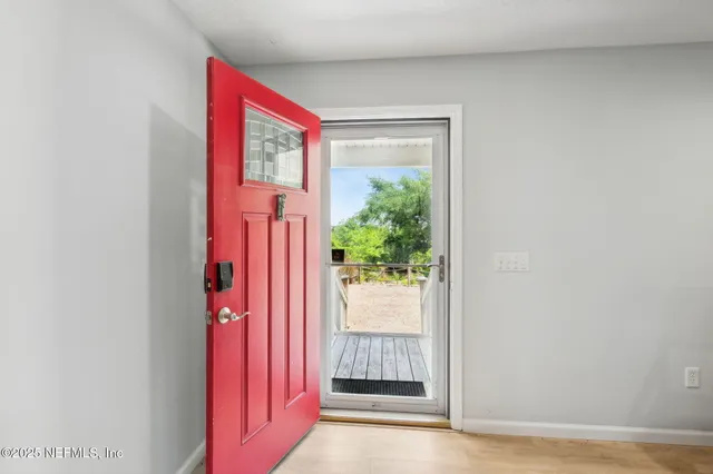 a view of front door with a hallway