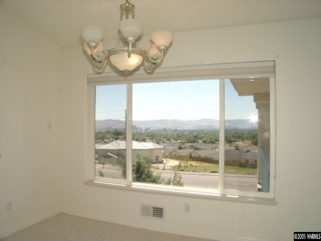 3100 Coronado Way Reno, NV 89503 - Photo 3 of 9 a room with a large window and a chandelier