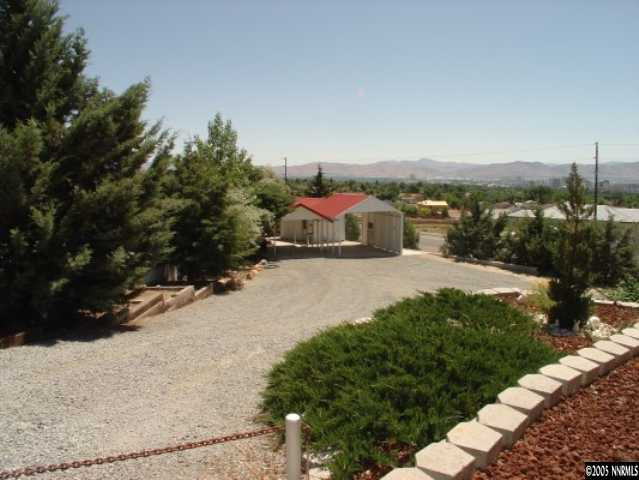 3100 Coronado Way Reno, NV 89503 - Photo 7 of 9 a view of a road with a yard