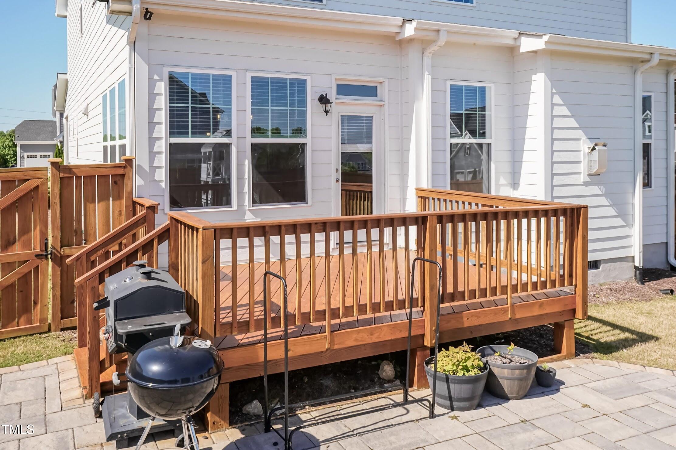 536 Adkins Ridge Road Rolesville, NC 27571 - Photo 12 of 52 a view of a chair and tables in the balcony