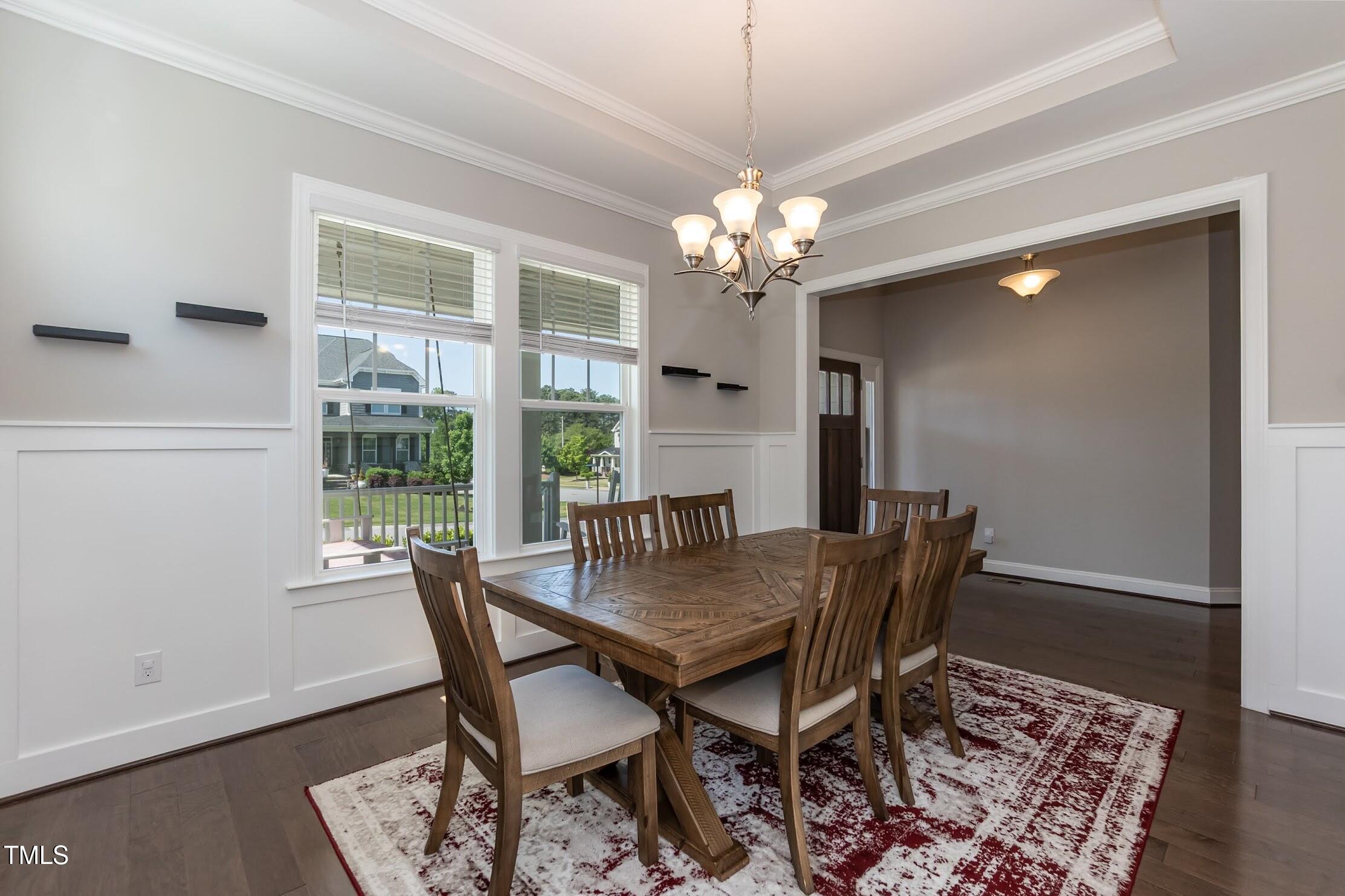 536 Adkins Ridge Road Rolesville, NC 27571 - Photo 21 of 52 a view of a dining room with furniture window and wooden floor