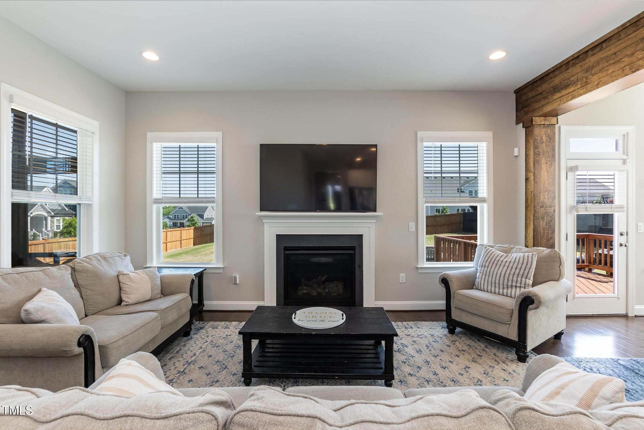 536 Adkins Ridge Road Rolesville, NC 27571 - Photo 30 of 52 a living room with furniture and a fireplace