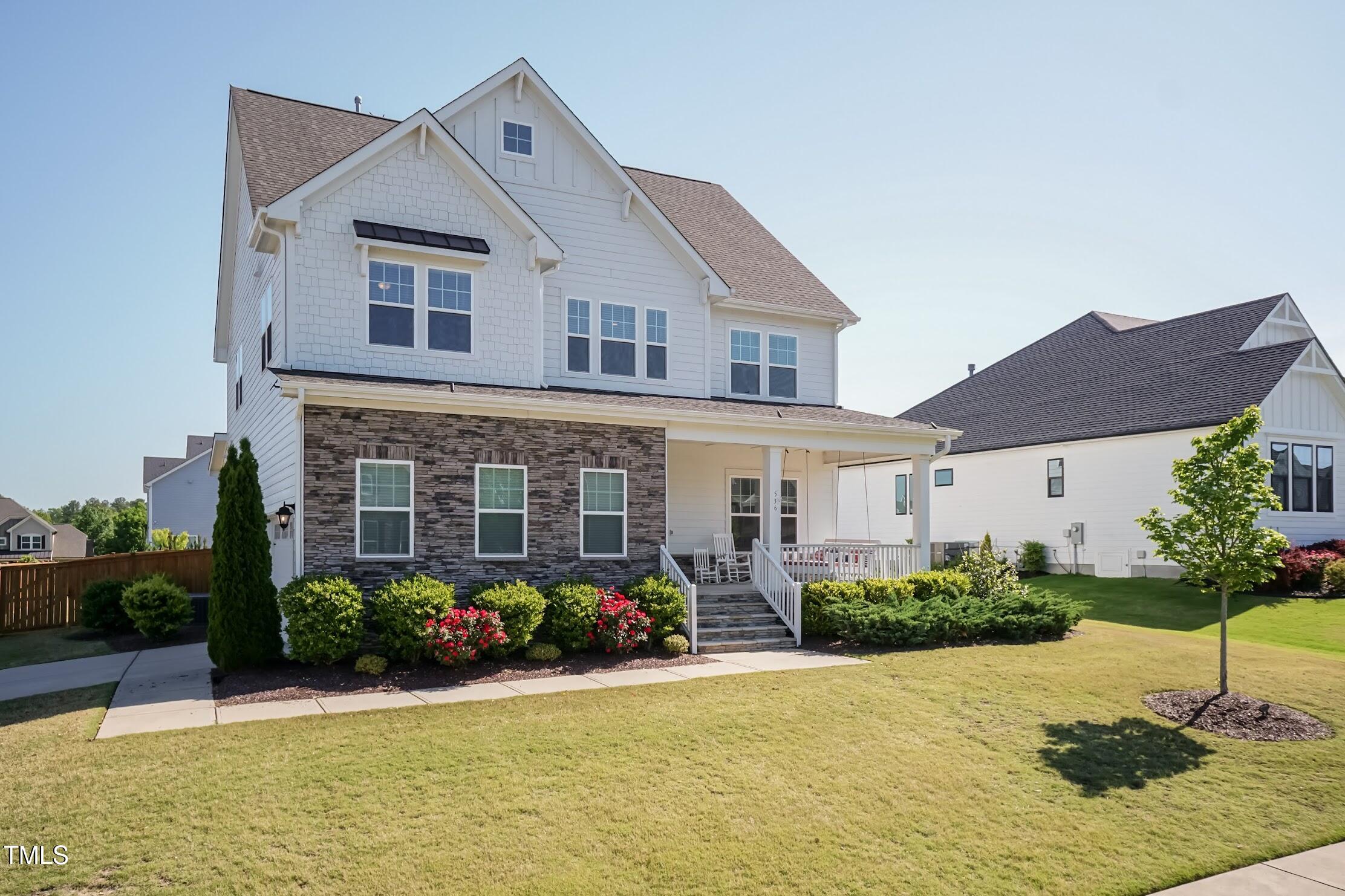 536 Adkins Ridge Road Rolesville, NC 27571 - Photo 3 of 52 a front view of a house with garden