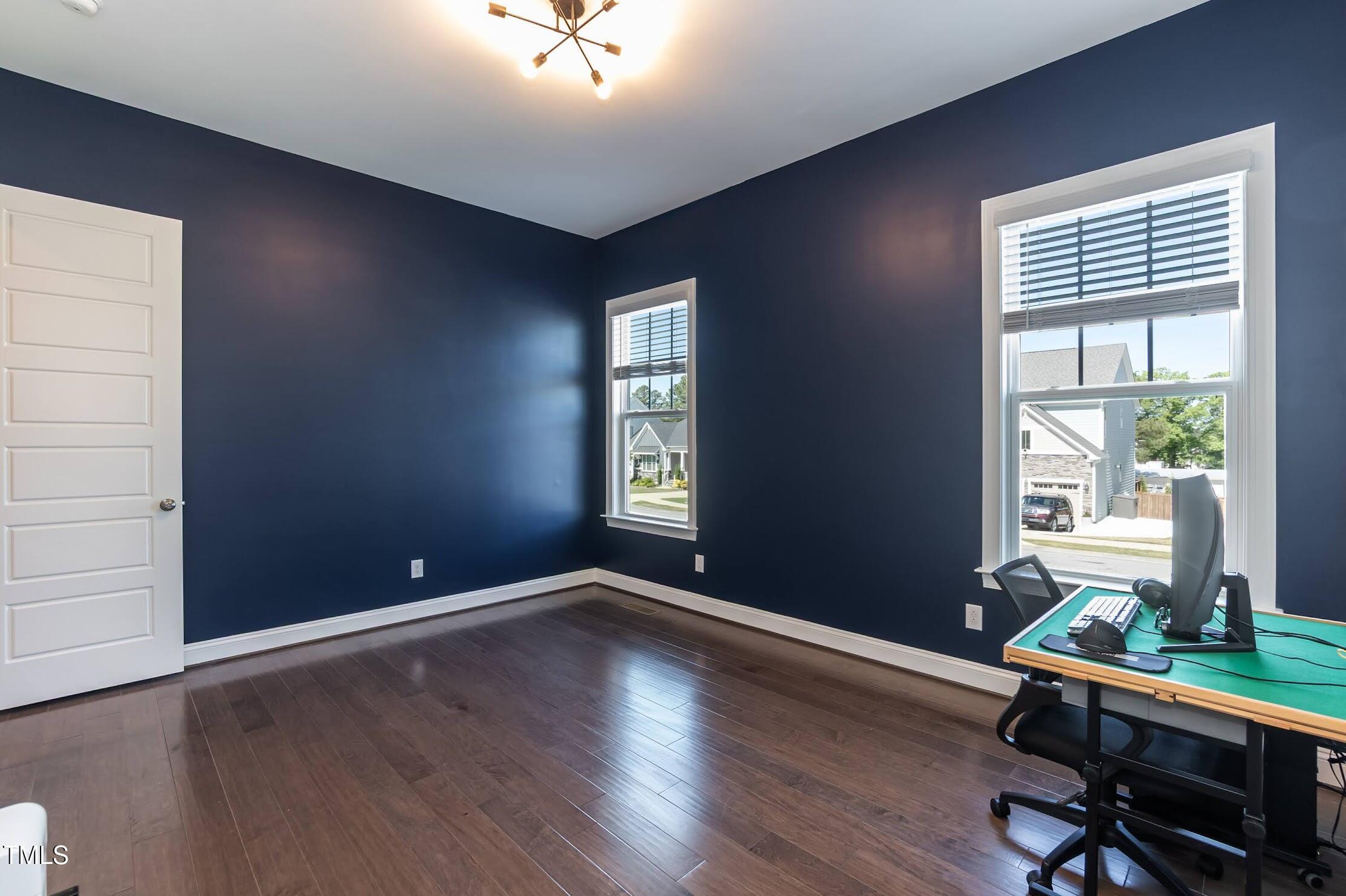 536 Adkins Ridge Road Rolesville, NC 27571 - Photo 34 of 52 a workspace with wooden floor and windows