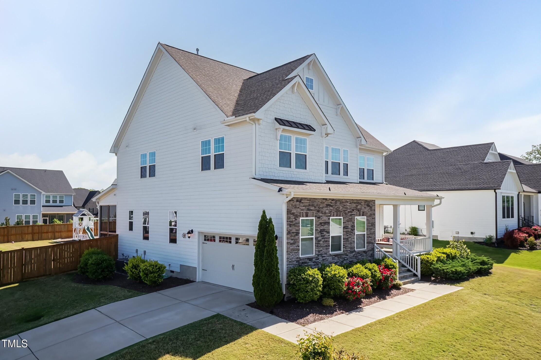 536 Adkins Ridge Road Rolesville, NC 27571 - Photo 4 of 52 a front view of a house with garden
