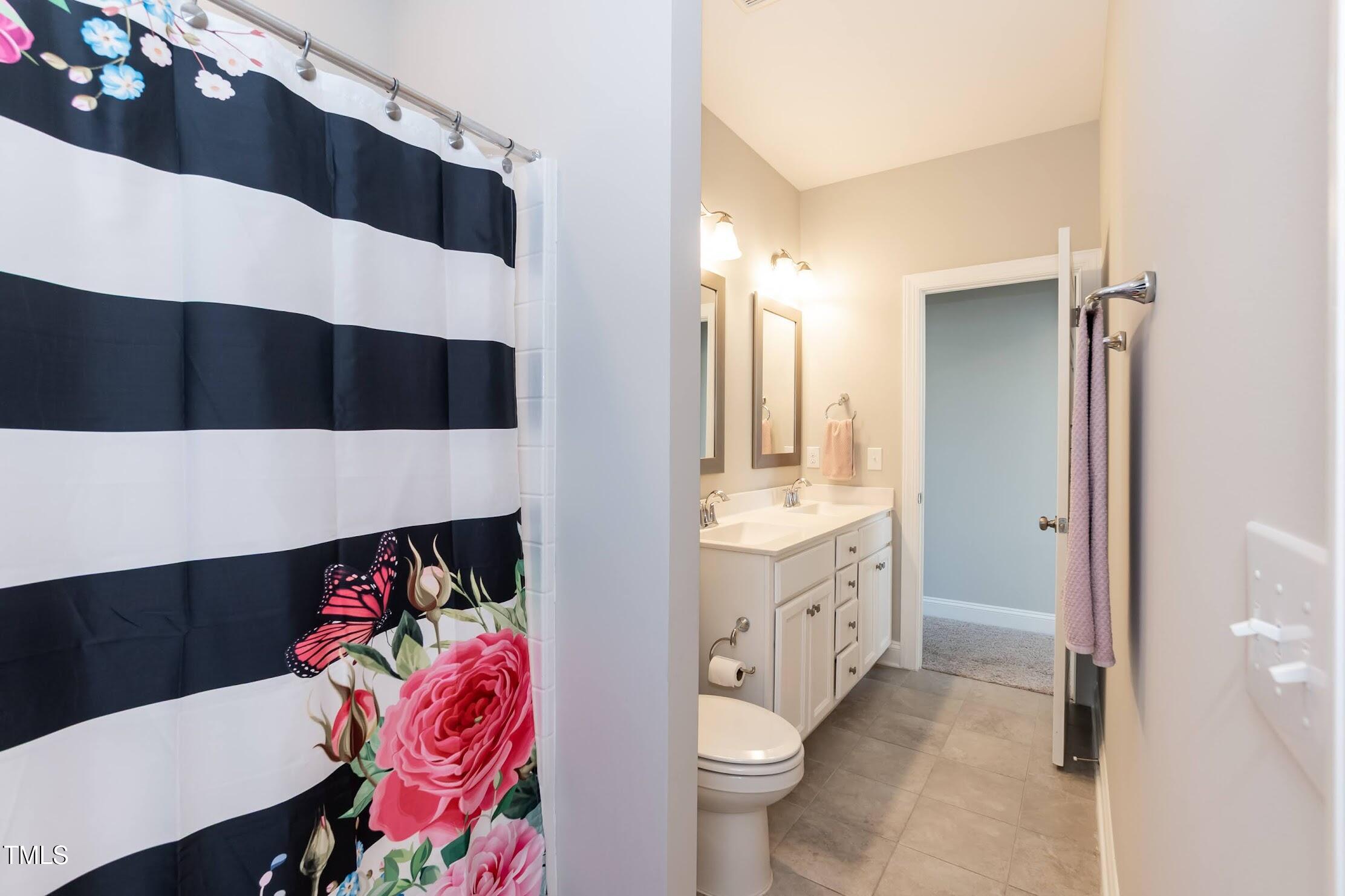 536 Adkins Ridge Road Rolesville, NC 27571 - Photo 43 of 52 a bathroom with a sink a toilet and shower