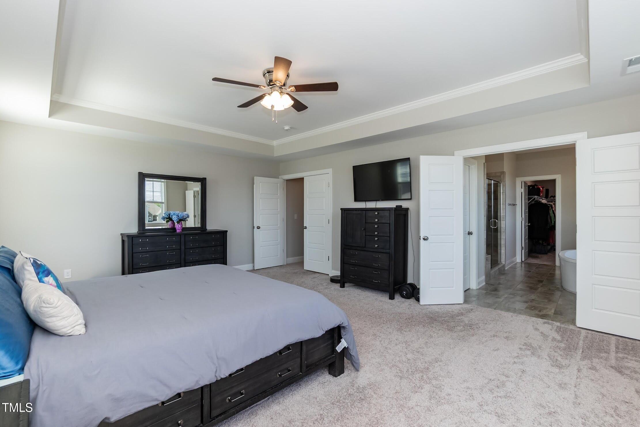 536 Adkins Ridge Road Rolesville, NC 27571 - Photo 48 of 52 a bed room with a bed and a television