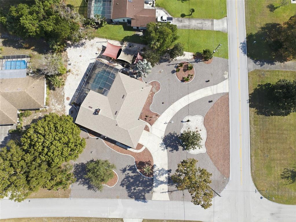 8123 River Country Drive Weeki Wachee, FL 34607 - Photo 15 of 61 an aerial view of a house with a yard and balcony