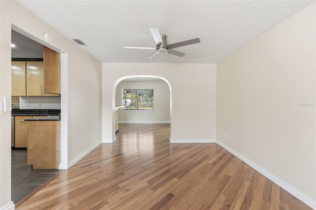 8123 River Country Drive Weeki Wachee, FL 34607 - Photo 25 of 61 a view of empty room with wooden floor
