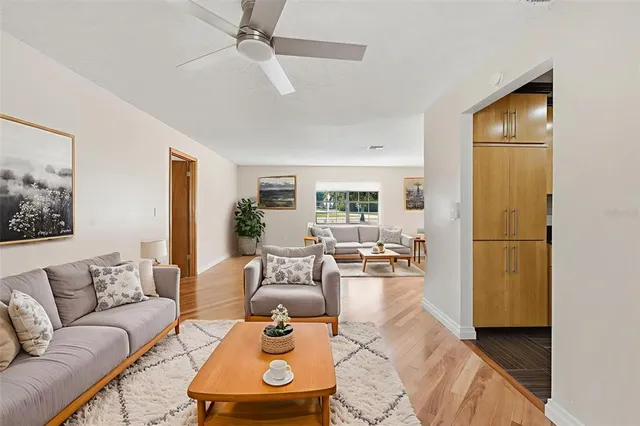 a kitchen with stainless steel appliances kitchen island granite countertop a stove a sink and a refrigerator