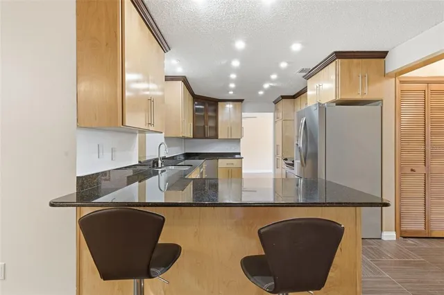 a bathroom with a sink a toilet and a shower