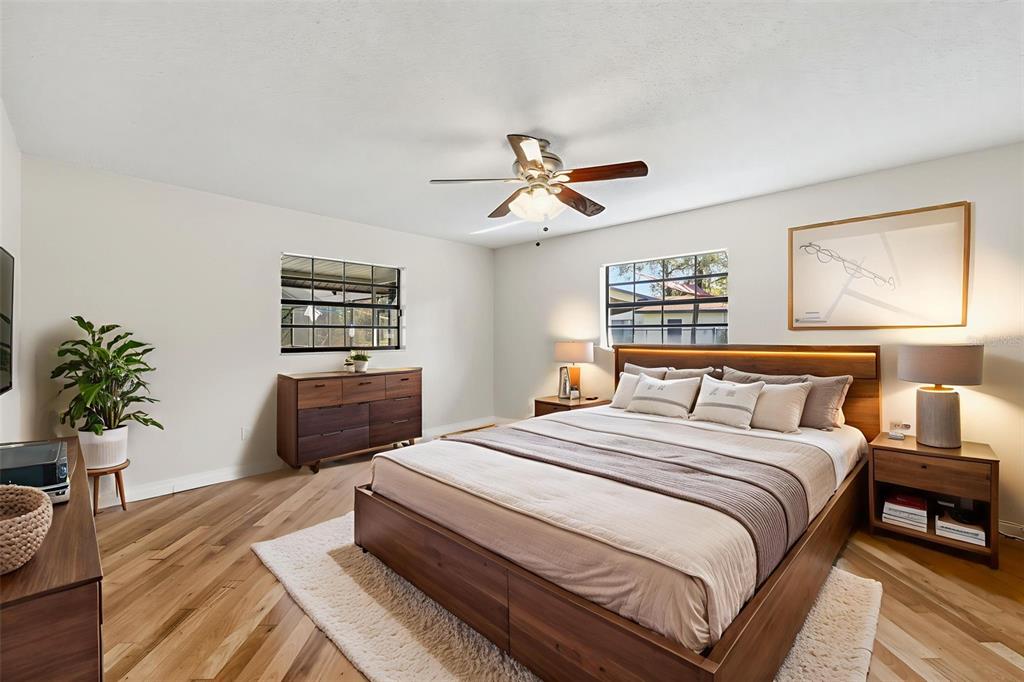 8123 River Country Drive Weeki Wachee, FL 34607 - Photo 40 of 61 a bedroom with a bed and a potted plant