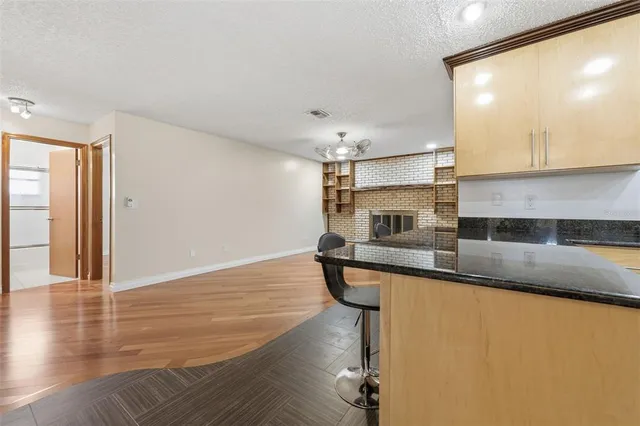 a view of a bathroom with a sink and mirror
