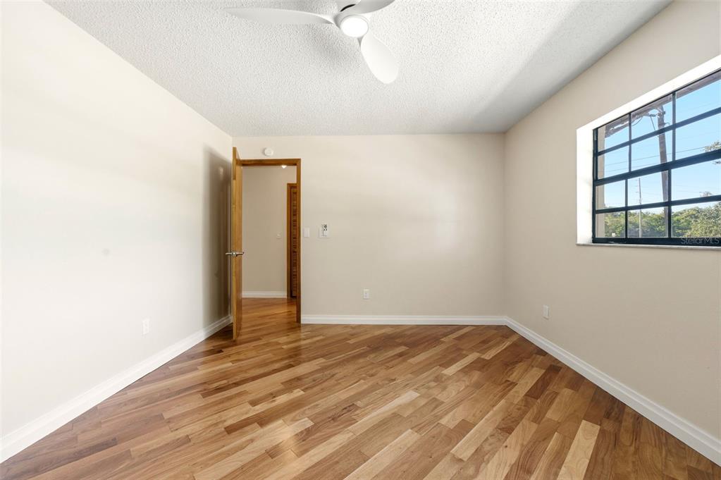 8123 River Country Drive Weeki Wachee, FL 34607 - Photo 48 of 61 a view of a room with wooden floor and a window