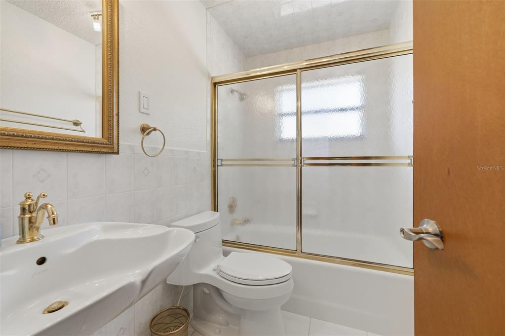 8123 River Country Drive Weeki Wachee, FL 34607 - Photo 49 of 61 a bathroom with a sink toilet and shower