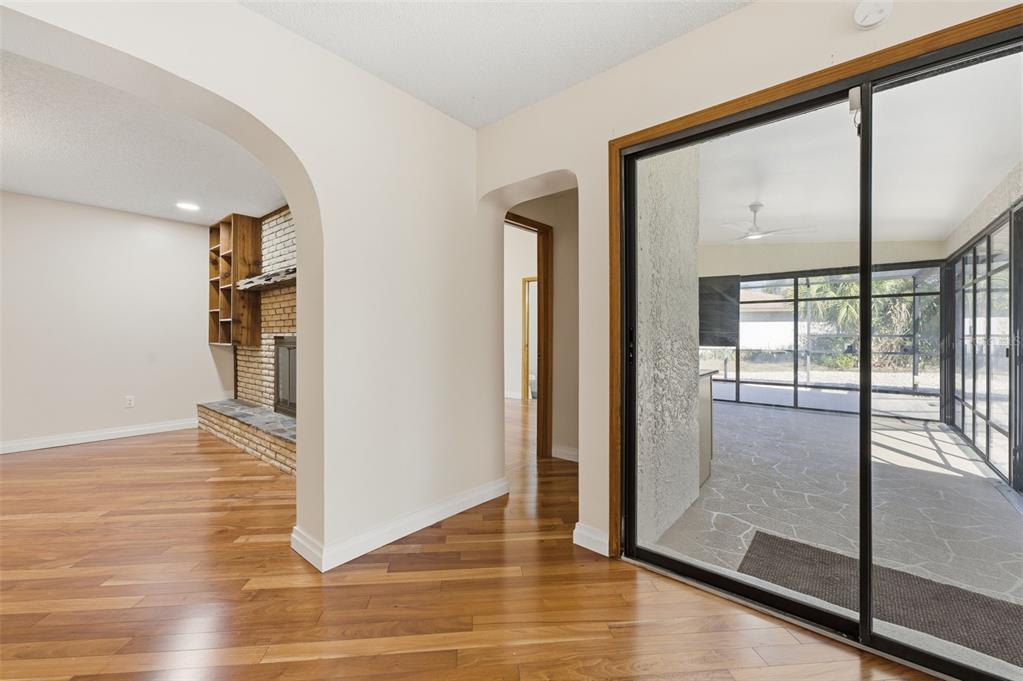 8123 River Country Drive Weeki Wachee, FL 34607 - Photo 51 of 61 a view of a big room with wooden floor and windows
