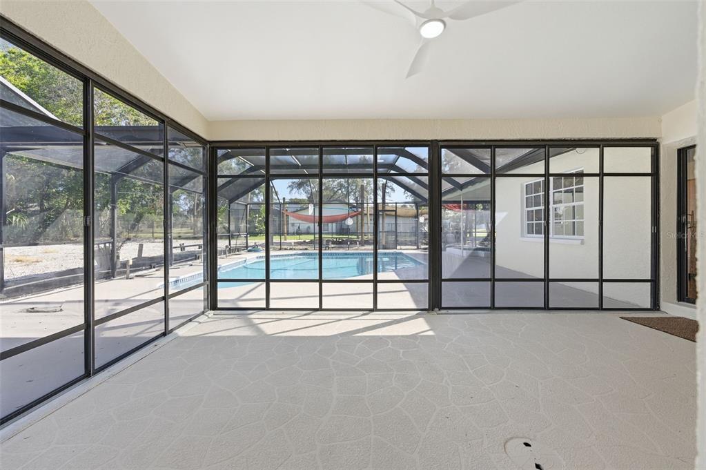 8123 River Country Drive Weeki Wachee, FL 34607 - Photo 57 of 61 a view of an empty room with a large window with outer view