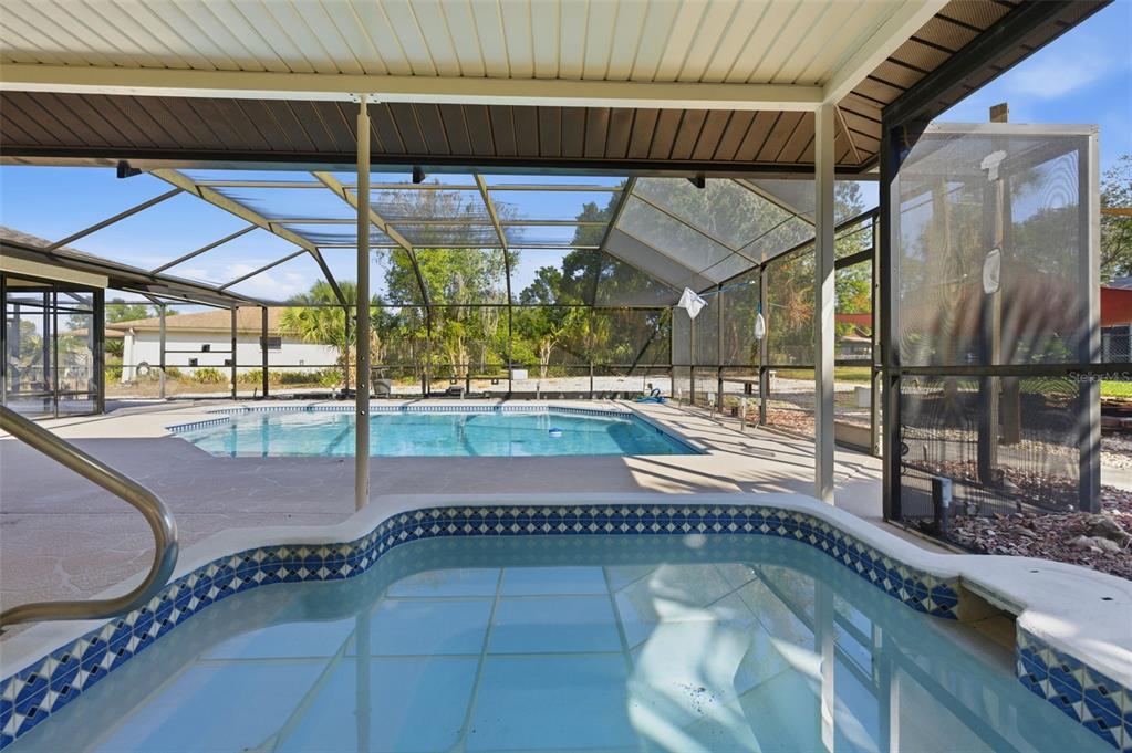 8123 River Country Drive Weeki Wachee, FL 34607 - Photo 60 of 61 a view of a swimming pool with a patio