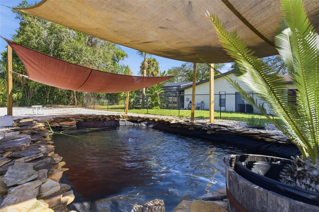 8123 River Country Drive Weeki Wachee, FL 34607 - Photo 6 of 61 a view of swimming pool with outdoor seating and plants