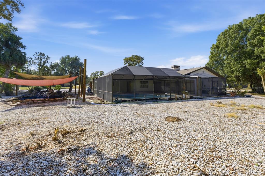 8123 River Country Drive Weeki Wachee, FL 34607 - Photo 7 of 61 a front view of a house with a yard and garage